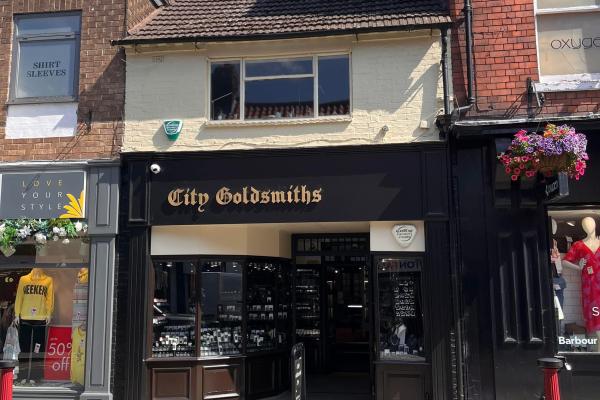 Here you go — a polished third‑person version with improved grammar, plus a 160‑character summary.  ---  ### **Third‑person version**   City Goldsmiths is an independent, family‑run jewellers that has been part of Newark for fifty‑two years after relocating from Nottingham. The shop offers a wide selection of new silver and gold jewellery, continuing its long tradition of craftsmanship and personal service.  ---  ### **160‑character summary**   A long‑established family jewellers in Newark offering a wide r